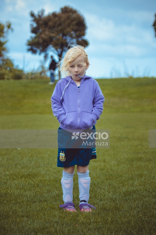 Blonde girl wearing indigo coloured hoodie - Little Dribblers