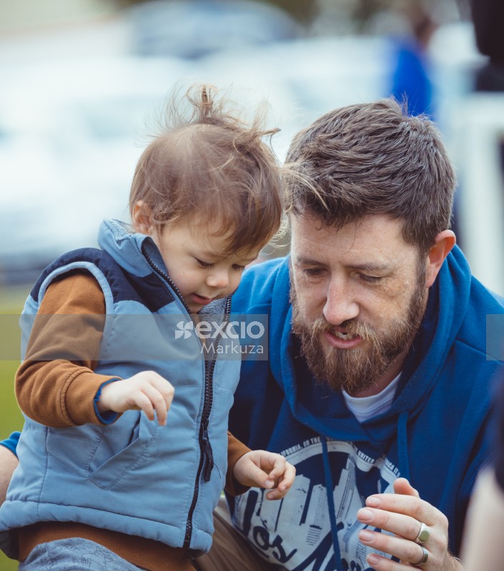 Father and son in blue hoodie and sleeveless jacket - Little Dribblers