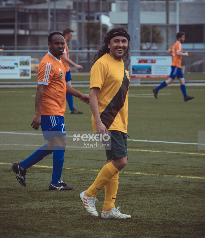 Football player with long hair and headband - Sports Zone sunday league