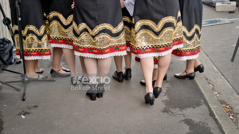 Ladies wearing embroidered lace dress and low heels at Newtown festival 2021
