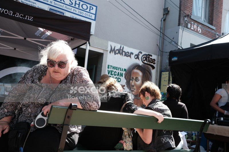 Old woman on a bench at Newtown festival 2021