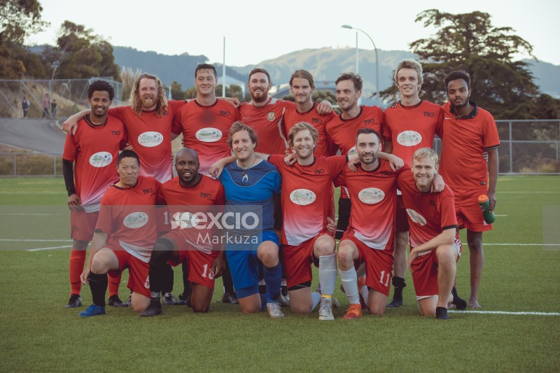 Group photo of team in red kit - Sports Zone sunday league