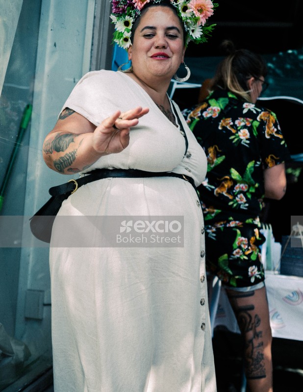Tattooed women wearing flowers in hair at Newtown Festival 2020