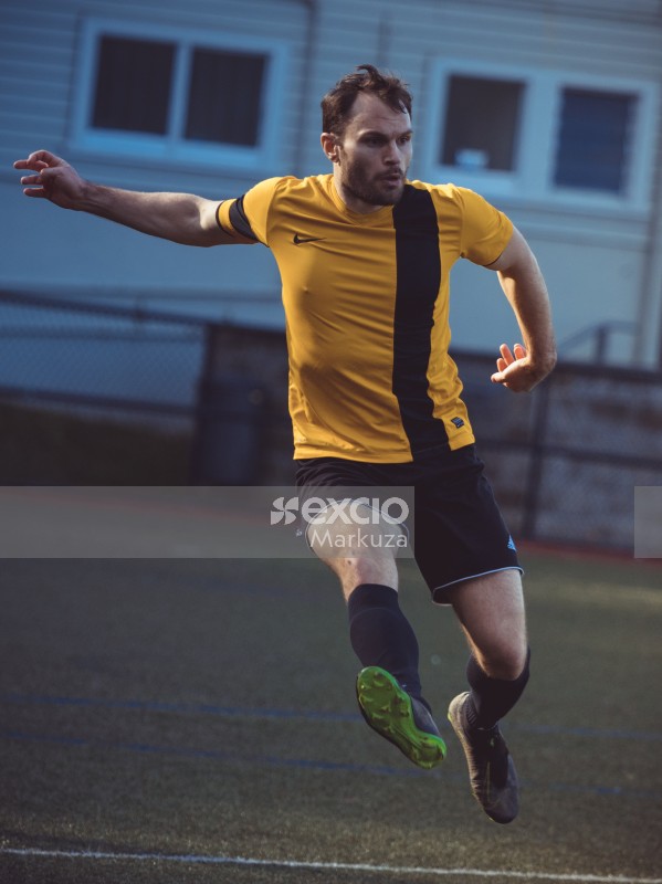 Football player running fullbody portrait - Sports Zone sunday league