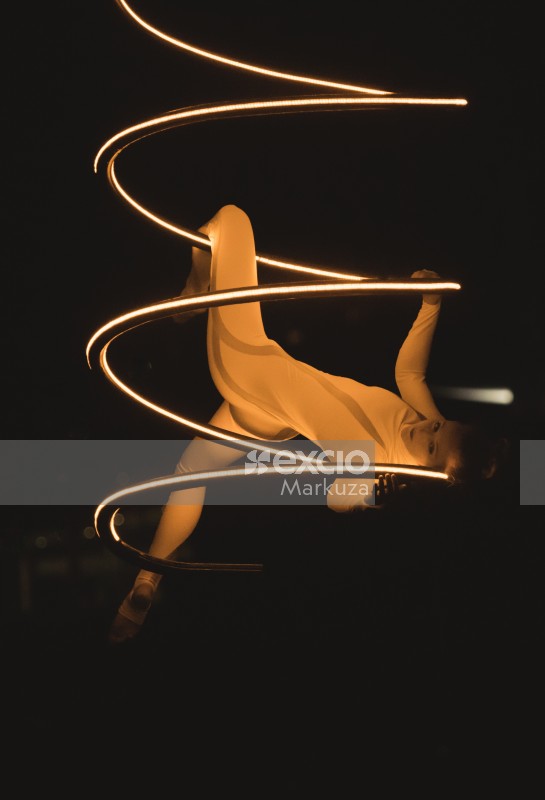 Artistic acrobatics with a lighting spiral structure