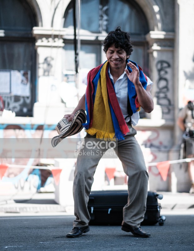 A happy man dancing in the street at Cuba Dupa 2021 bokeh