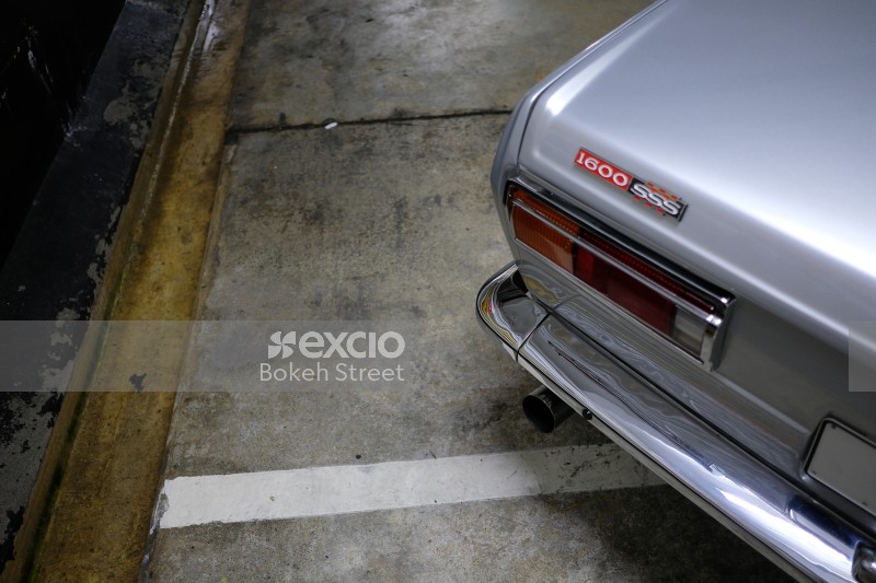 Classic silver Datsun 1600 SSS tail light bumper and exhaust