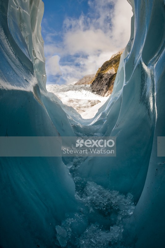Walking through an ice cave on the glacier
