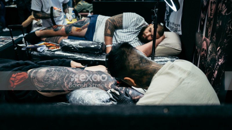 Tattoo artists work their art at Wellington tattoo convention 2021