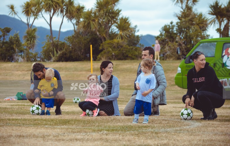 Parents and kids at Little Dribblers football game