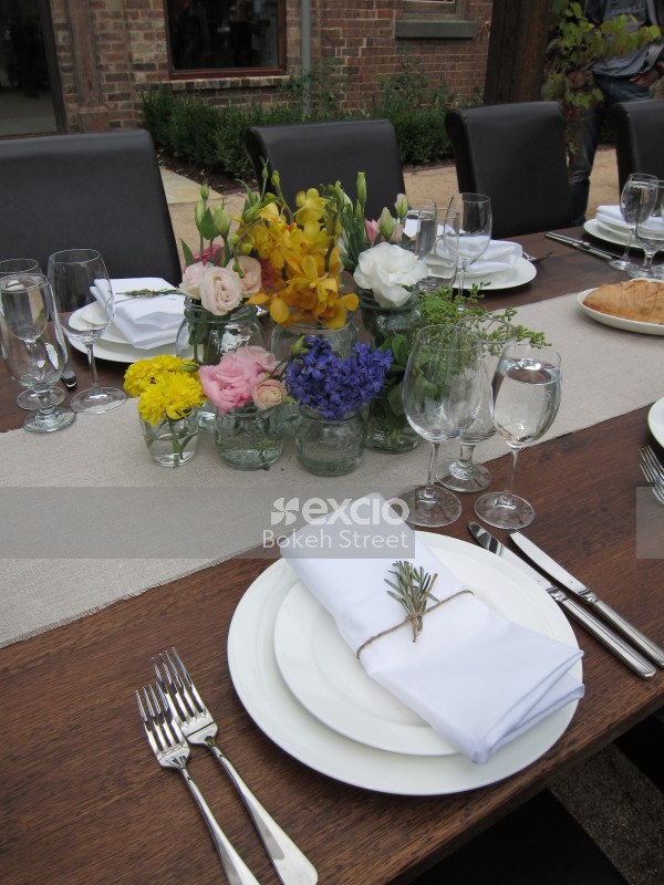 Flowers on a dining table set outdoor