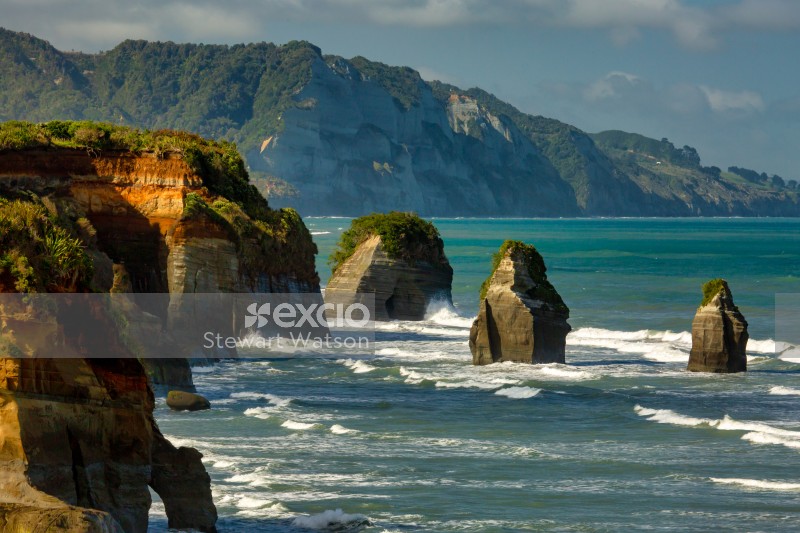 Three sisters rock formations at high tide