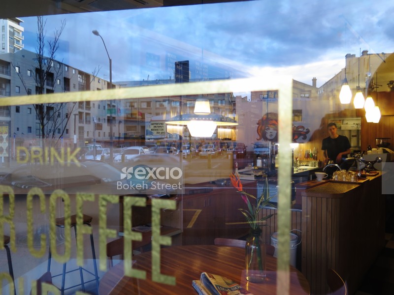 Reflection on glass and view inside coffee shop