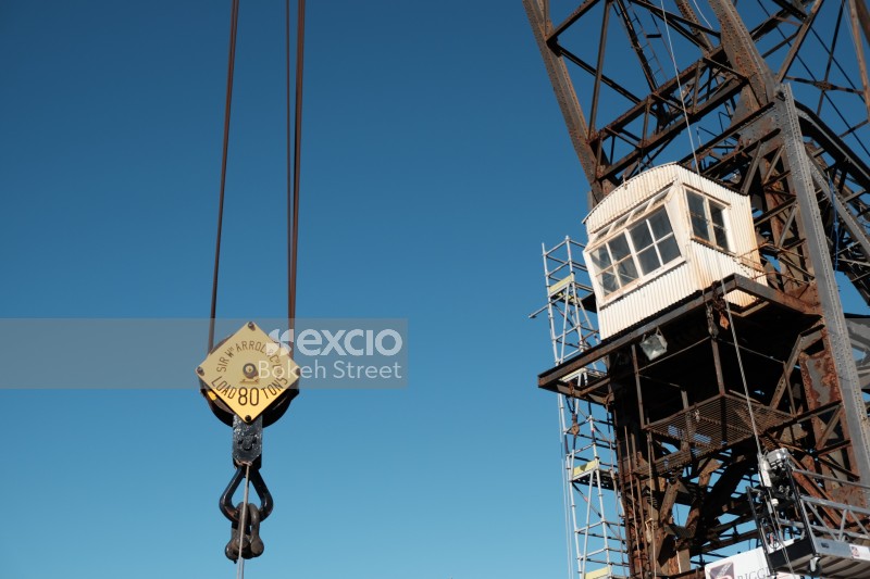 Rusty crane and clear blue skies