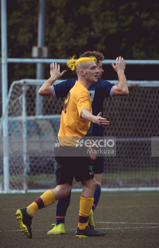 Yellow haired player objecting to a call - Sports Zone sunday league