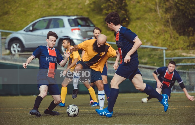 Bald player appears to be stomping on the ball - Sports Zone sunday league