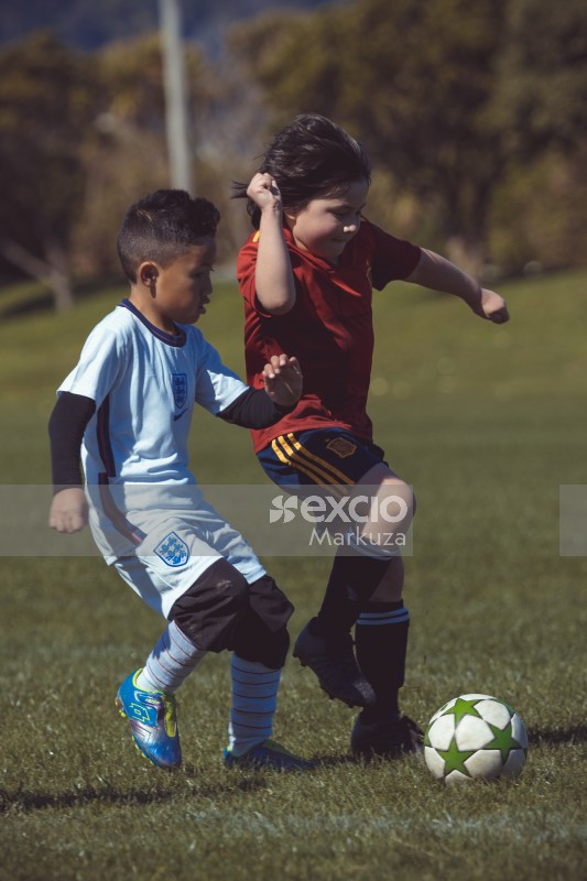 Little kids playing football at Little Dribblers football match