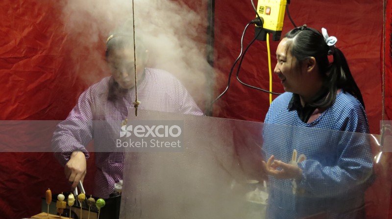 Steam from making street food