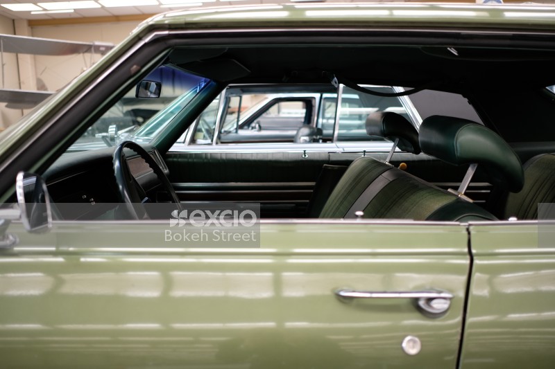 Left side interior view of green classic car