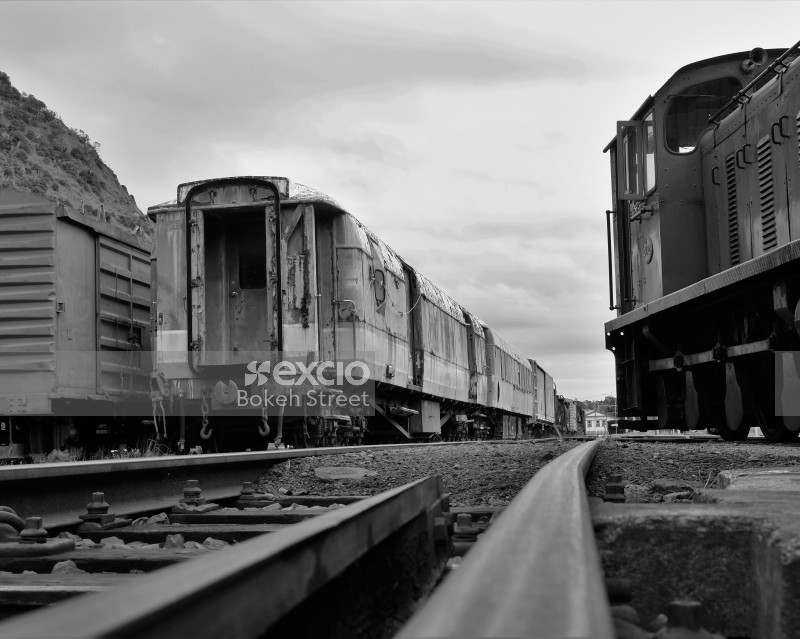 Abandoned old trains on tracks monochrome