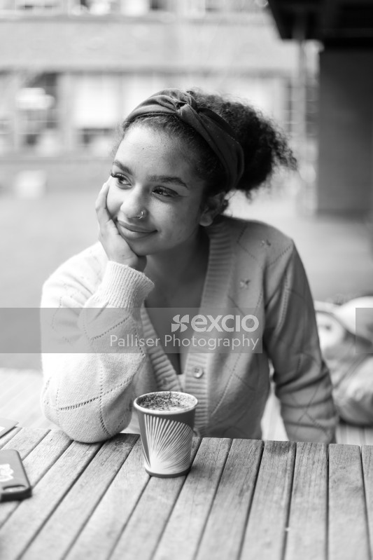 B&W portrait of a lady with coffee