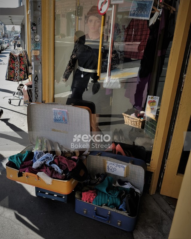 Old clothes and shoes for sale outside a store on Cuba street