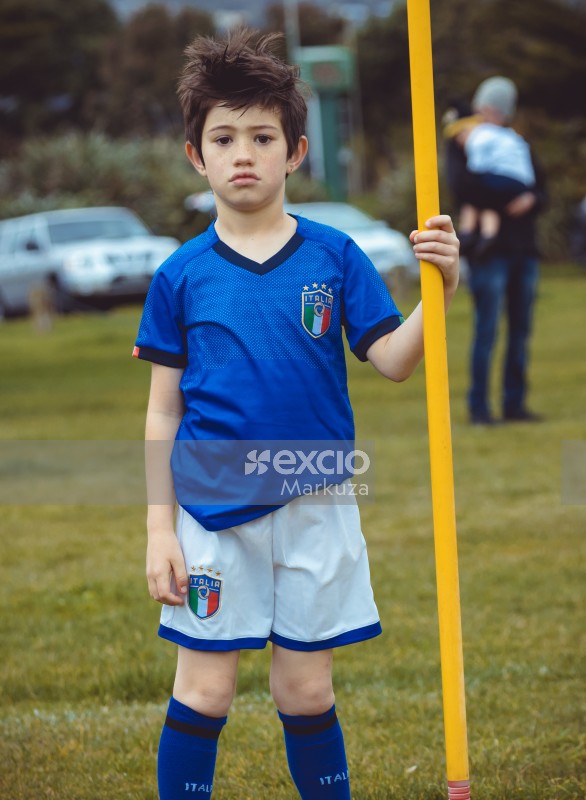 Boy in Italia kit holding a yellow hoist - Little Dribblers