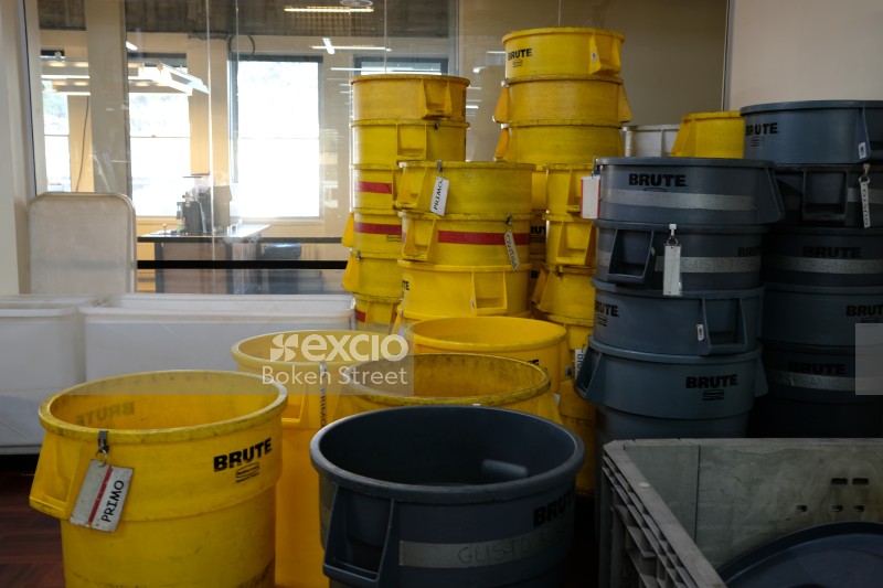 Brute yellow and grey buckets at a coffee warehouse