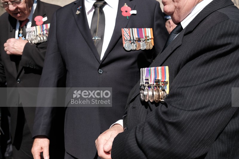 War veterans in suits with medals at Anzac Day 2017