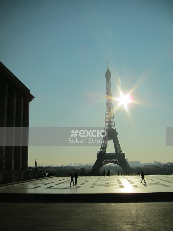 Shining sun and the Eiffel tower Paris