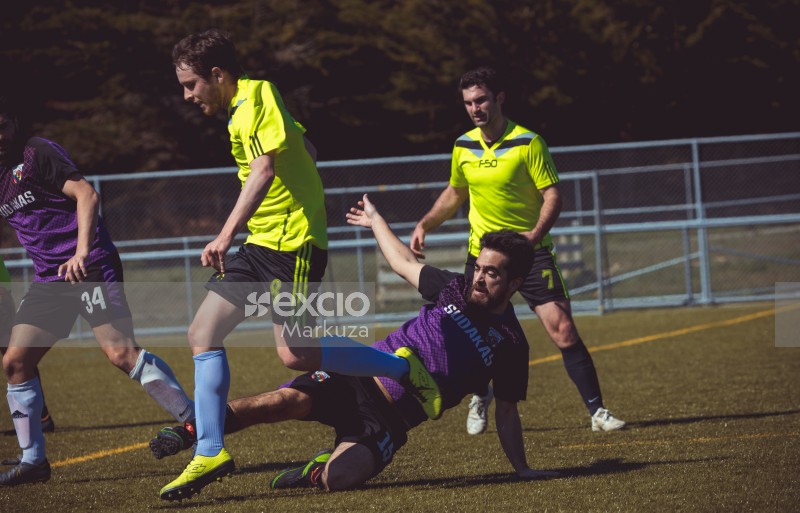 Player No. 15 in purple shirt slide tackle opponent - Sports Zone sunday league