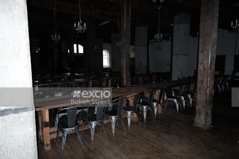 Mess hall with table and chairs at a distillery
