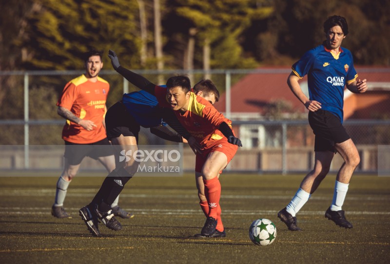 Football player losing balance after a tackle - Sports Zone sunday league