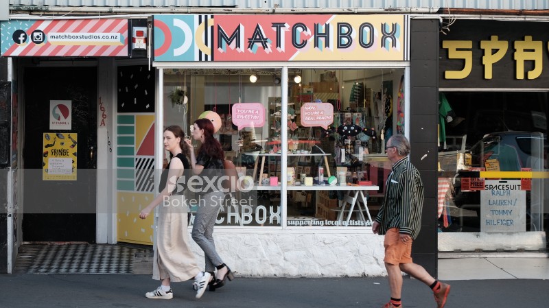 People walking by shops in a street at Wellington