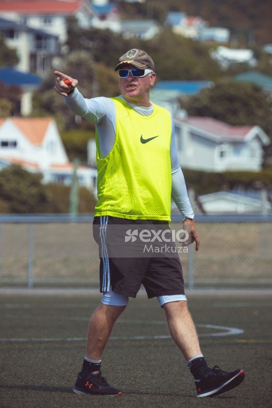 Referee with neon Nike scrimmage vest pointing with finger - Sports Zone sunday league