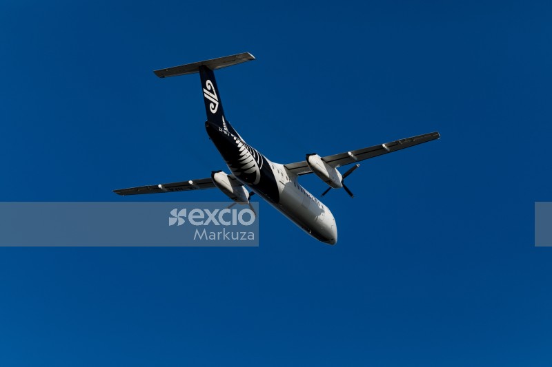 AIR New Zealand aircraft in the deep blue sky