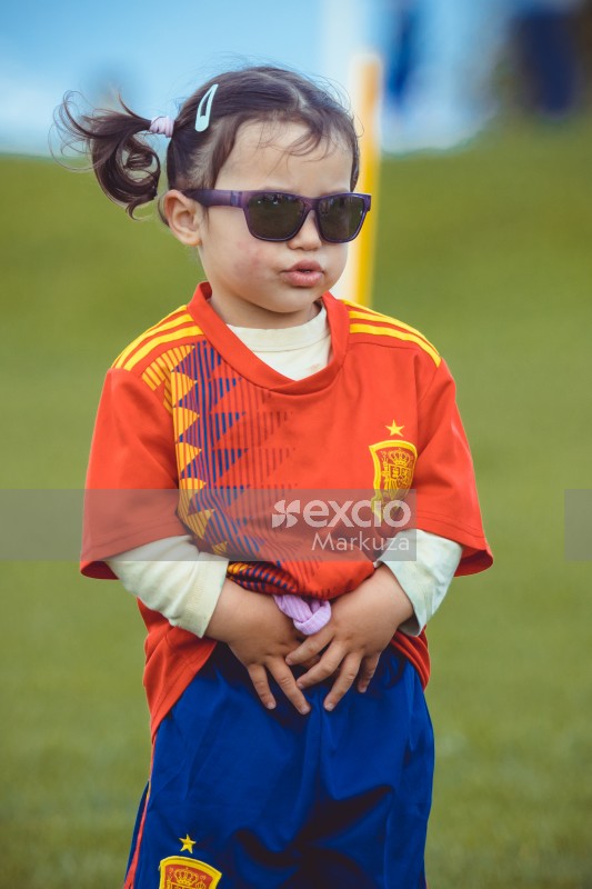 Little girl wearing purple sunglasses and Manchester United kit - Little Dribblers