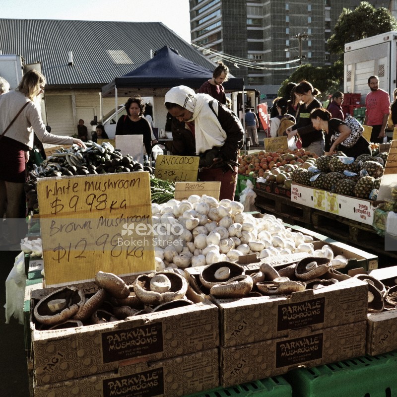 Mushrooms and other produce at fruit & vegetable market