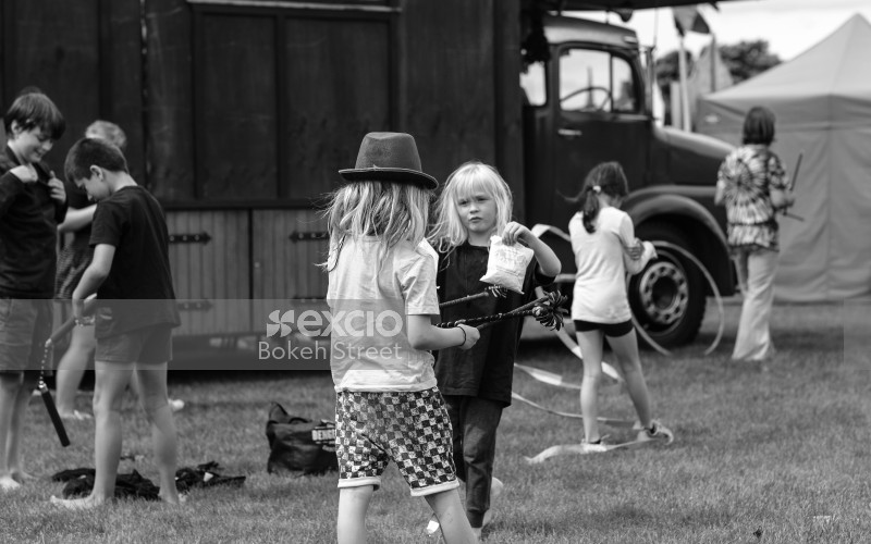 Children playing at festival black and white