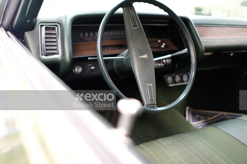 Interior of classic Pontiac steering wheel and speedometer