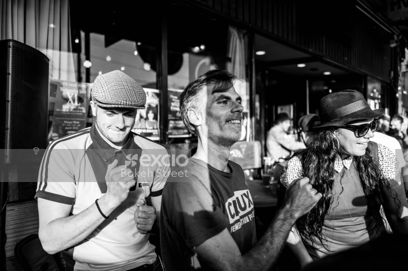 Men and women dancing to music at Newtown festival 2021 monochrome
