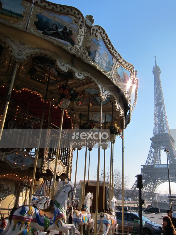 Merry go round carousel and Eiffel tower Paris