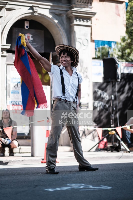 Guy with a multicoloured scarf posing at Cuba Dupa 2021 bokeh
