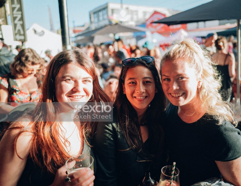 A trio of female friends pose for a picture at Newtown festival 2021