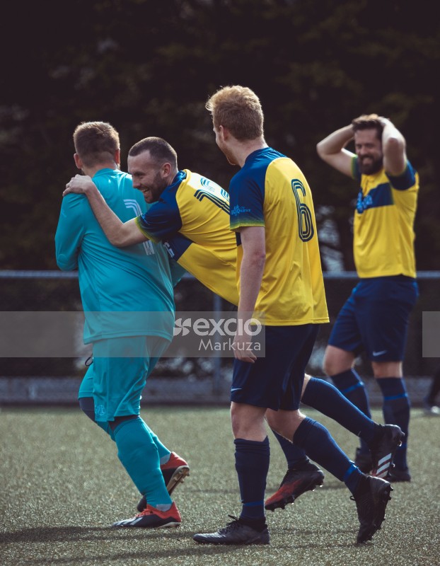 A joyous moment for players in the yellow and blue kit - Sports Zone sunday league