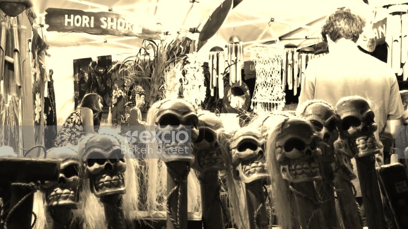 Artificial skulls on sticks at a souvenir shop at WOMAD festival