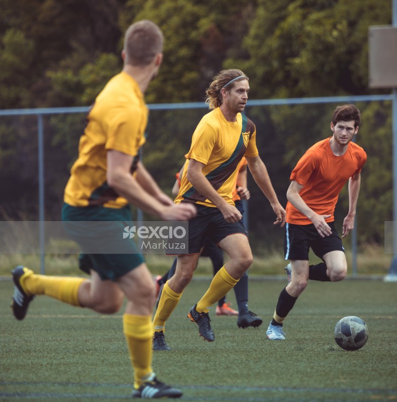 Player with long hair and hairband focus on the goal - Sports Zone sunday league