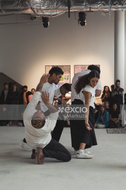 A group of performers performing an artistic dance