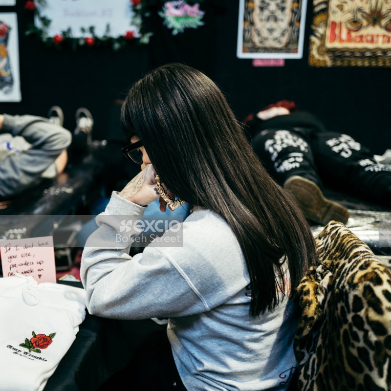 Dark haired woman at Wellington tattoo convention 2021