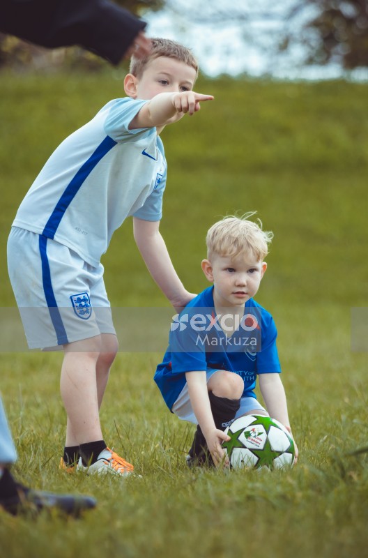 Boy pointing opponent team player - Little Dribblers
